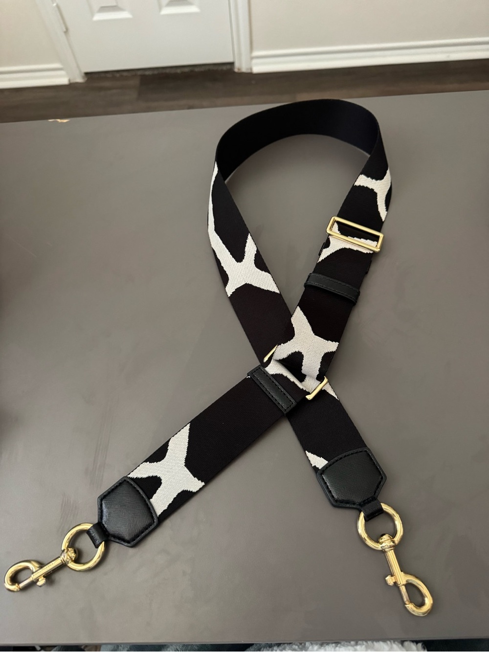 Adjustable Black and White Crossbody Strap with Gold Hardware